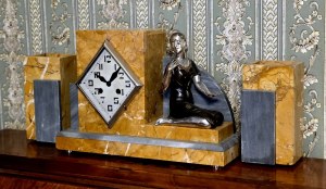 Art Deco mantel clock with figure of a woman with a rose - France first half of the 20th century