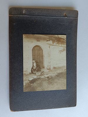 PHOTO ON CARD FROM OLD ALBUM WOMAN IN FRONT OF HOUSE