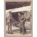 Charles Lindbergh next to the Spirit of St. Louis.
