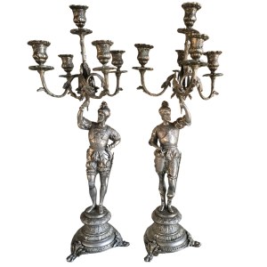 Pair of candlesticks with conquistadors