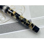 Pen - This Omas Extra Lucens in black and gold celluloid with HT finish...