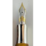 Pen - This special Millennium model in light speckled amber resin...