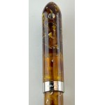 Pen - This special Millennium model in light speckled amber resin...