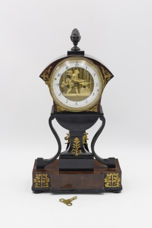Mantel clock with figure of winged blacksmith