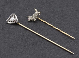 Jewellery - Two gold and diamond brooches in the shape of a dog and tri...