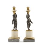 Pair of candlesticks with putti
