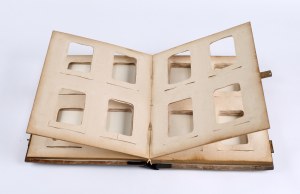 WASHINGTON] CDV photo album in carved wood binding with relief of chamois. [Poland, early 20th century]
