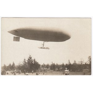 Russian Empire Photocard - Military Zeppelin in Flight Over Forest with Officers, ca. 1910s
