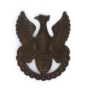 Eagle with wavy lower edge of amazon shield - letter L
