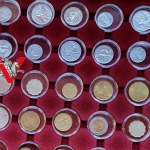 6 coin / medal pallets plus 64 coins in caps ! lots of mint