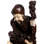 Signed wood carving with bone inlays, depicting Fukurokuju with child, 19th century