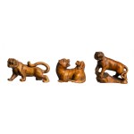 Set of three wooden netsuke depicting tigers, early 20th century.