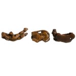 Set of three wooden netsuke depicting tigers, early 20th century.