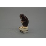 Pacykow, Pacykow, Monkey sitting on a book, ca. 1920-1939, faience