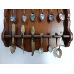 Set of collectible spoons in a wooden display case
