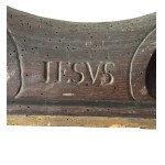 Carved wooden frame with religious figures