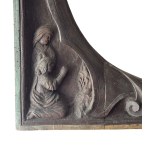 Carved wooden frame with religious figures