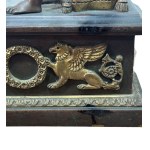 Pair of patinated bronze fireplace andirons depicting putti