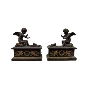 Pair of patinated bronze fireplace andirons depicting putti
