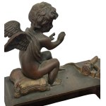 Pair of patinated bronze fireplace andirons depicting putti