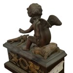 Pair of patinated bronze fireplace andirons depicting putti