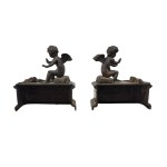 Pair of patinated bronze fireplace andirons depicting putti
