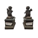 Pair of patinated bronze fireplace andirons depicting putti
