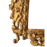 Carved and gilded wooden mirror