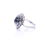 Sapphire ring with diamond entourage varying in height