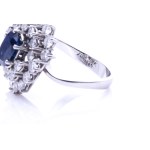 Sapphire ring with diamond entourage varying in height