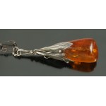 Pendant with amber on a chain, author
