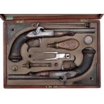 A pair of percussion pistols in a cartridge