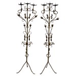 Pair of baroque three-arm wrought iron candlesticks