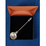 A scooping spoon with a mysterious finial. 2nd half of the 19th century.