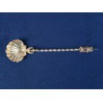 A scooping spoon with a mysterious finial. 2nd half of the 19th century.