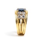 Gold band ring with sapphire and diamonds -