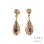 Tightening clips with ruby and rosettes, 1st half of the 20th century