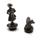 Pair of tin, silver-plated wine stoppers turn of 19th and 20th century