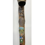 Wooden walking stick with badges of Polish and foreign mountain huts