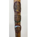 Wooden walking stick with badges of Polish and foreign mountain huts
