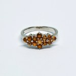 Silver ring with natural orange sapphires