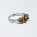 Silver ring with natural orange sapphires