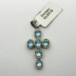 Silver cross pendant with blue topazes