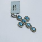 Silver cross pendant with blue topazes