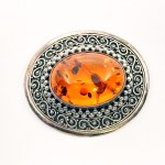 Silver brooch with large Amber