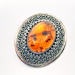 Silver brooch with large Amber