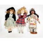 Three dolls in boxes