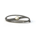 Designer brooch with a pearl and marcasites