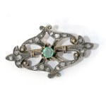 A Victorian brooch with diamonds and an emerald