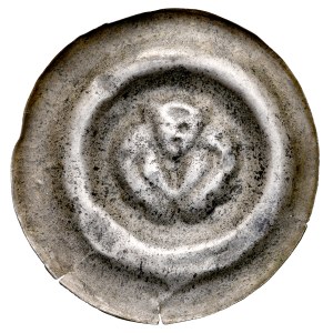 Silesia, wide bracteate, 13th century, obverse: A head with raised wings.